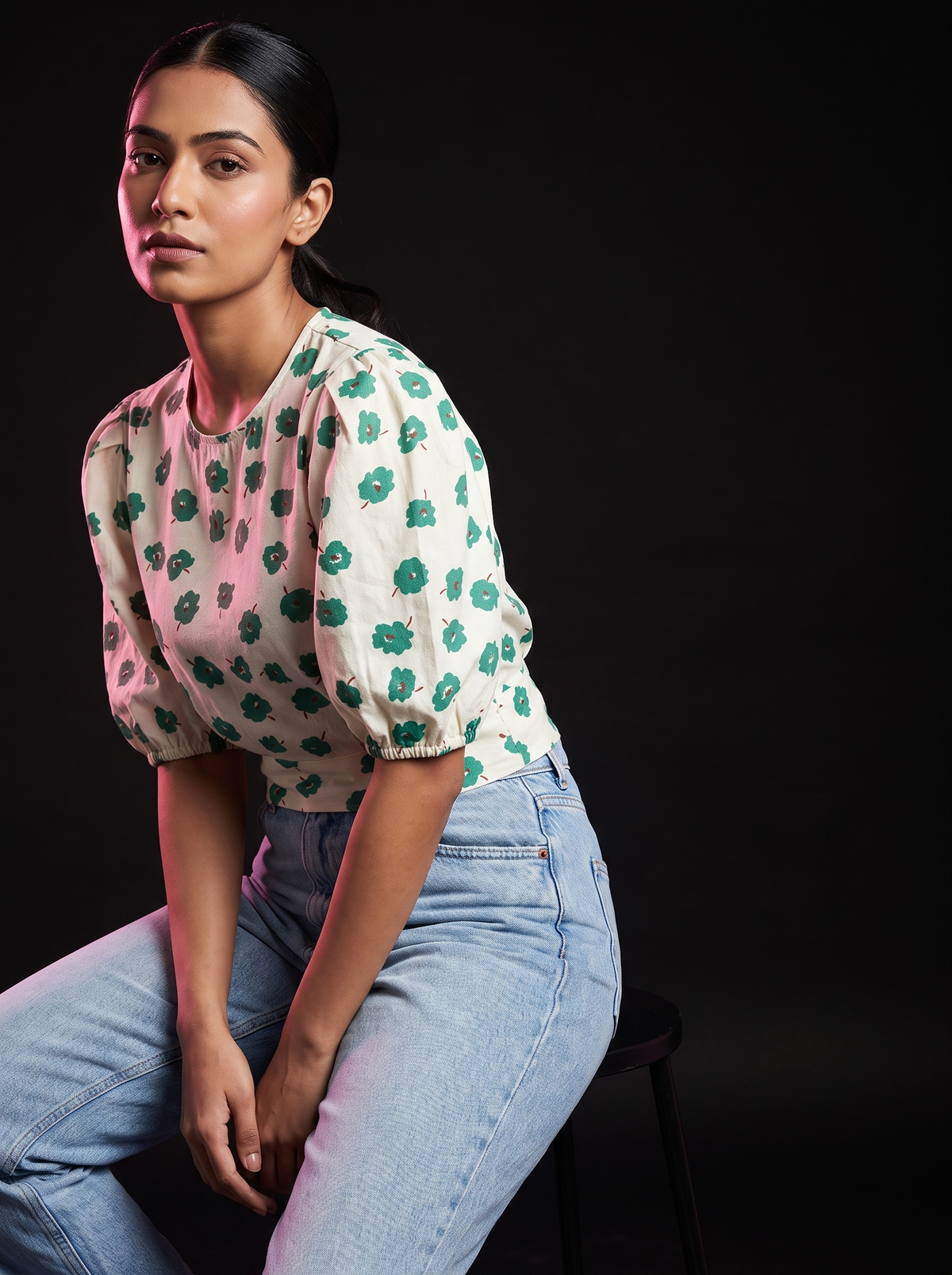 Sneak - AI editorial fashion photo, sitting pose, black studio background