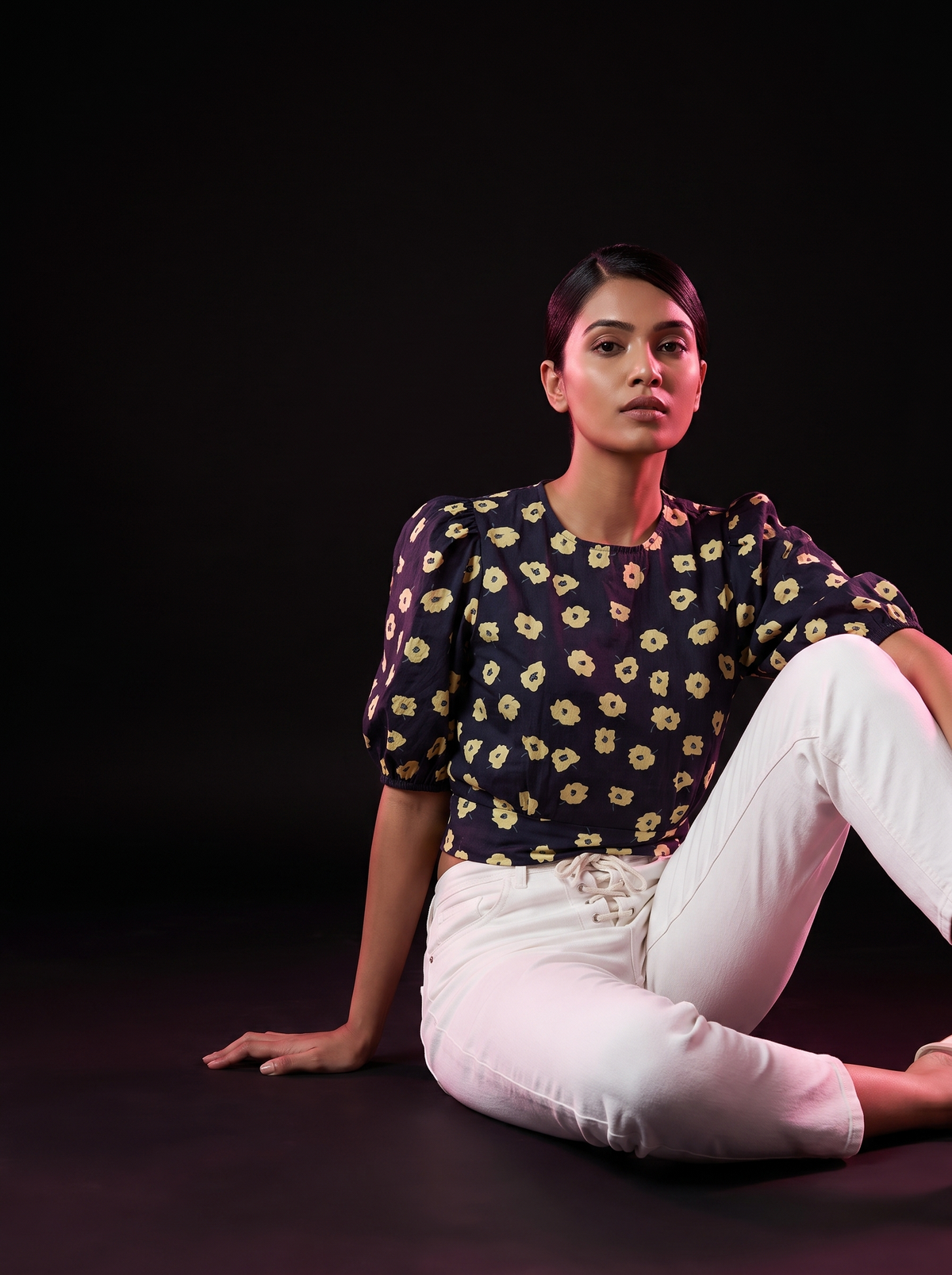 Bloom - AI editorial fashion photo, sitting pose, black studio background