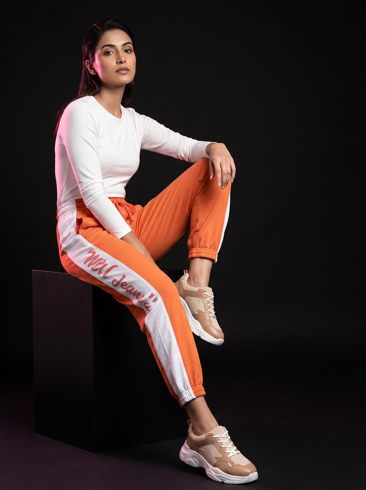 Citrus shake - AI editorial fashion photo, sitting pose, black studio background